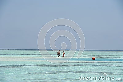 People in the sea at Paradise Island, Maldives. March 2012 Editorial Stock Photo