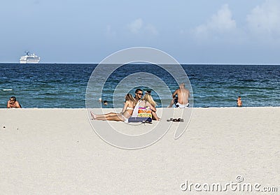 People at the sea side in South Beach, Miami Editorial Stock Photo