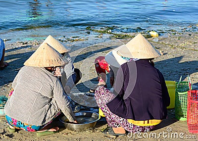 People selling fishes at the market in Phan Thiet, Vietnam Editorial Stock Photo