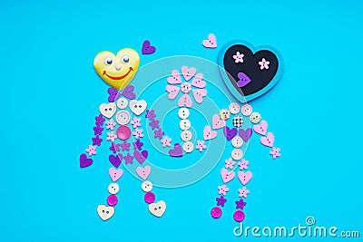 People shape with flower made from round, flower and star shaped buttons Stock Photo