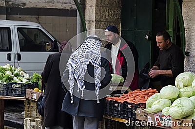 People shopping for vegetables in a market Editorial Stock Photo