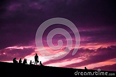 People silhoettes on sunset in Huacachina Stock Photo