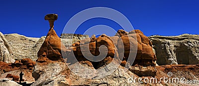 People in Silhouette at Toadstool Hoodoos in Southwest Red Sandstone Blue Sky Wilderness Stock Photo