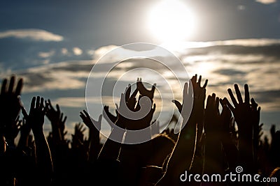 People silhouettes with raised up a human hands Editorial Stock Photo