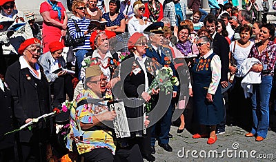 People sing war songs. A woman plays accordeon. Editorial Stock Photo