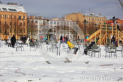 People sit on chairs in the winter on the island of new Holland Editorial Stock Photo