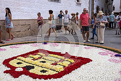 People during Sitges Corpus Christi at a flower carpet in Sitges, Spain Editorial Stock Photo