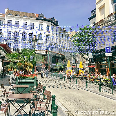 People sitting in the cafe with busy street in brussels belgium during summer sitting outside. 17-09-2017 Editorial Stock Photo