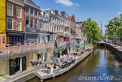 People sitting in the sun at a canal in Leeuwarden Editorial Stock Photo