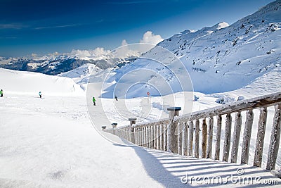 People skiing on the prepared slope with fresh new powder snow i Stock Photo