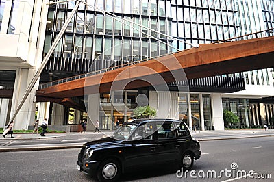 Urban scene in with iconic taxi in London , England Editorial Stock Photo