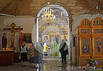 People stand on church service in Church of the Assumption. Poshekhonje, Yaroslavl region Editorial Stock Photo