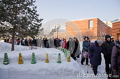 People stand in line in the cathedral for blessed water Editorial Stock Photo