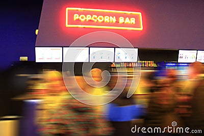 People stand in line for popcorn Stock Photo