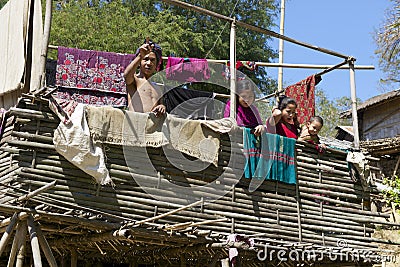 People stand at the Marma hill tribe house, Bandarban, Bangladesh. Editorial Stock Photo