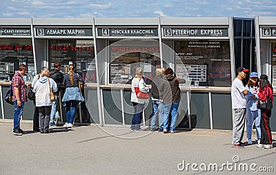 People stand near the ticket office to buy a ticket on the hydrofoil boat meteor. Peterhof, Russia Editorial Stock Photo