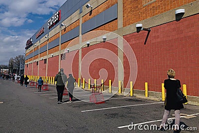 People Standing in Line Social Distancing at New York City SupermarketsPeople Standing in Line Social Distancing at New York City Editorial Stock Photo