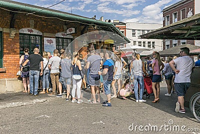 People standing in the queue Editorial Stock Photo