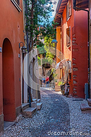 People are strolling thorugh a street in Malcesine in Italy Editorial Stock Photo