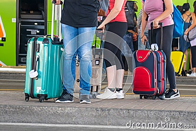 People with suitcases at the bus station Stock Photo