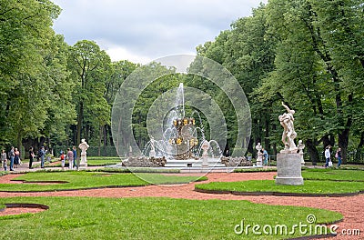 People in The Summer Garden near the fountain and the sculptures. St Petersburg. Russia Editorial Stock Photo