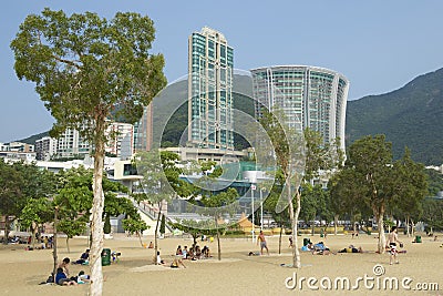 People sunbathe at the Stanley town beach in Hong Kong, China. Editorial Stock Photo