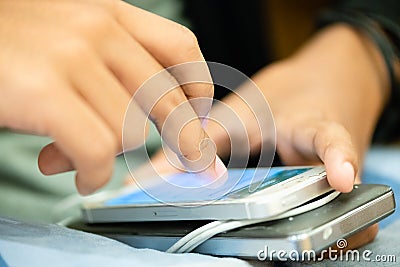 people surfing and browsing the web on smart phone.people enjoy with game in social media network on smart phone.portable power Editorial Stock Photo