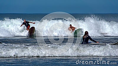 People surfing in Tamarindo Editorial Stock Photo