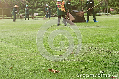 People are sweeping the floor. Stock Photo