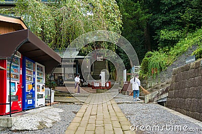 People sweeping floors at Kunozan Tosho-gu shrine Editorial Stock Photo