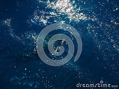 People swim and diving in plastic pollution on Liberty wreck ship in Tulamben, Bali Stock Photo