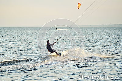 People swim in the sea on a kiteboard Editorial Stock Photo