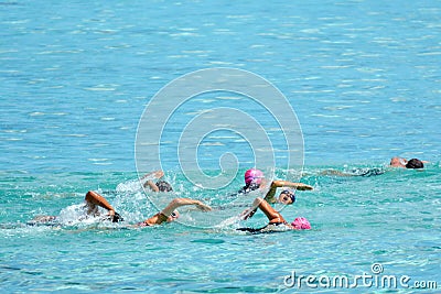 People swim the swimming stage of Raratonga triathlon contest Co Editorial Stock Photo