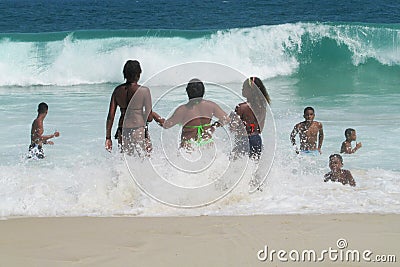 People swiming in the ocean waves Editorial Stock Photo