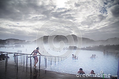 People swimming in the Blue Lagoon in Iceland Editorial Stock Photo