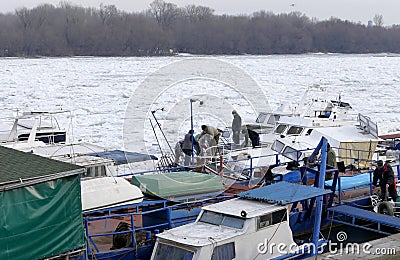 People take out trapped boat from the frozen Danube river Editorial Stock Photo