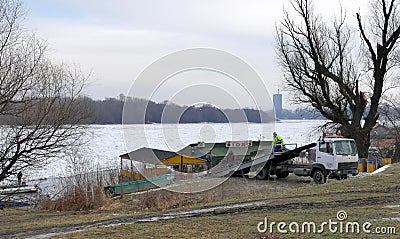 People take out trapped boat from the frozen Danube river Editorial Stock Photo