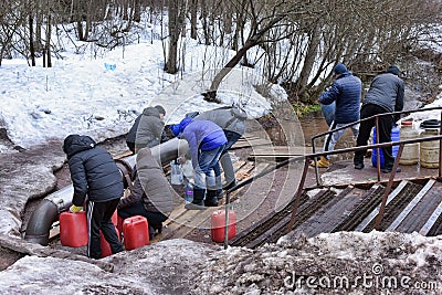 People take water from the spring Editorial Stock Photo