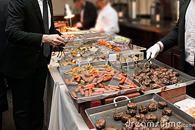 People Taking Food in Buffet Catering Dining Eating Party. Event Buffet Concept Stock Photo