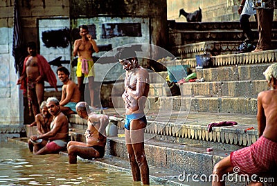 People taking the morning ritual bath in Varanasi Editorial Stock Photo