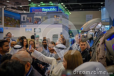 People taking selfies with TITAN - The Greeting Robot Editorial Stock Photo