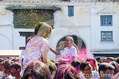 Hindu Holi festival of colors celebrations in Kathmandu Basantapur Durbar Square, Nepal Editorial Stock Photo