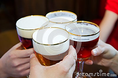 People toasting with a delicious Pale Ale Beer Stock Photo