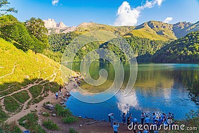 People tourists on alpine lake MaralGol is located in the GoyGol National Park in Azerbaijan Editorial Stock Photo