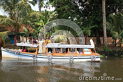 People travel in a small passenger boat in the backwaters Editorial Stock Photo