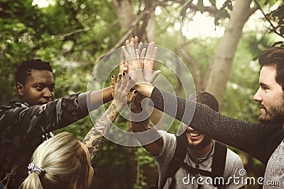 People Trekking in a forest Stock Photo