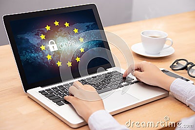 People using computer laptop with text GDPR or General Data Protection Regulation secure , star and padlock logo on monitor screen Stock Photo