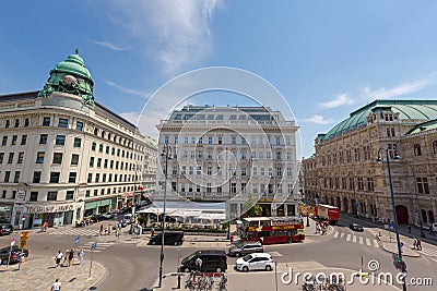 People, vehicle in front of cafe, hotel, state opera, on Albertina in the Innere Stadt First District of Vienna, Austria Editorial Stock Photo