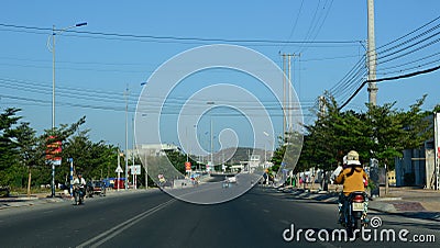 People and vehicles on 1A Highway in Binh Thuan, Vietnam Editorial Stock Photo