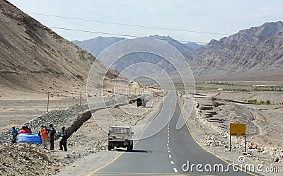People and vehicles on the mountain road in Ladakh, India Editorial Stock Photo